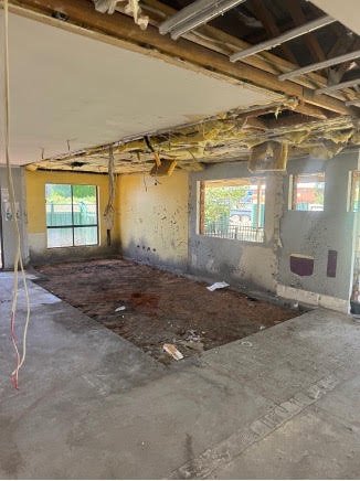 Interior with slab and flooring exposed before clean-up